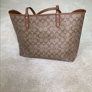 Coach large reversible tote with insert pouch.